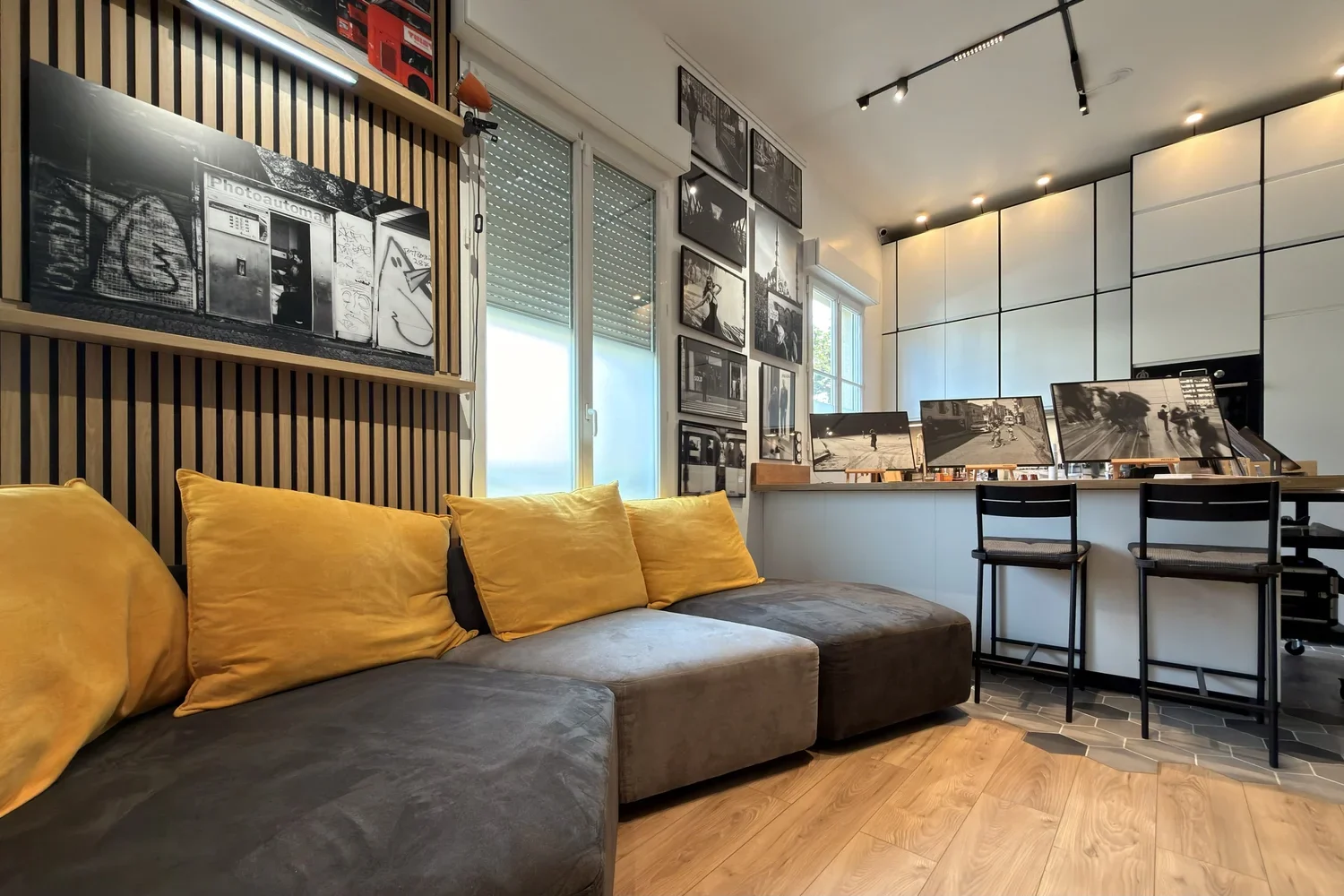 The studio’s seating area and photographs.